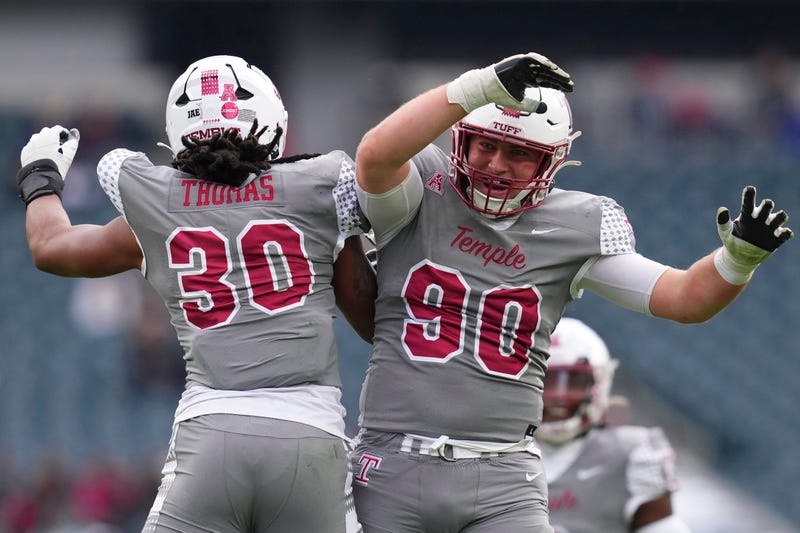 Tra Thomas, #30 of the Temple Owls, celebrates with Conlan Greene, #90, against the Navy Midshipmen in the first half at Lincoln Financial Field on Nov. 4, 2023, in Philadelphia, Pennsylvania.