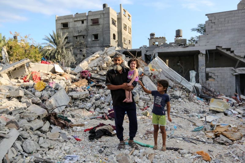 People search through buildings that were destroyed during Israeli air raids in the southern Gaza Strip. Neighborhoods have been wiped out and thousands have died and hundreds of thousands have been displaced. On October 7, Hamas launched a deadly attack in southern Israel that sparked a retaliatory siege of Gaza.