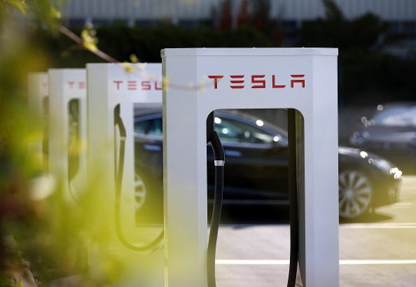 A row of new Tesla Superchargers are seen outside of the Tesla Factory on August 16, 2013 in Fremont, California.