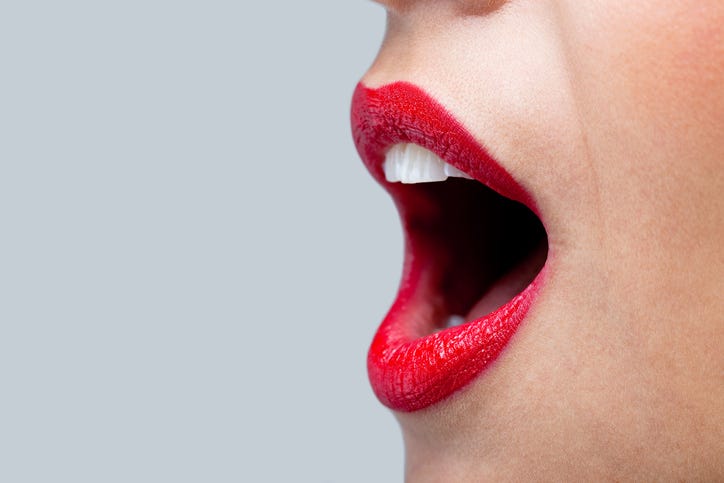 woman speaking with red lips