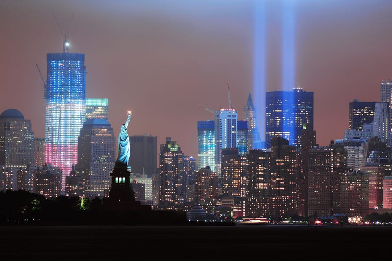 Statue of Liberty faces Manhattan downtown skyscrapers with 1 World Trade Center under construction on Septermber 11 in New York City.