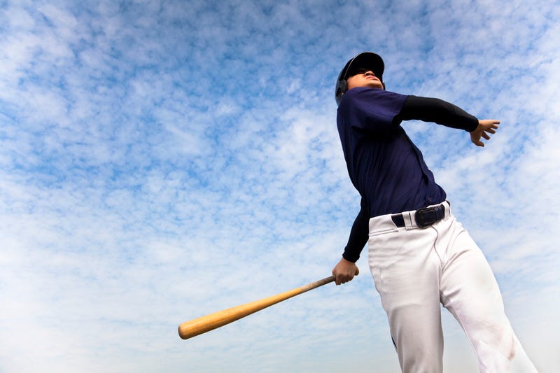 Baseball player hits home run