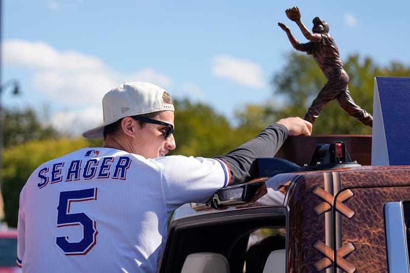 Corey Seager #5 of the Texas Rangers rides in a truck bed during the World Series Championship parade at Globe Life Field on November 03, 2023 in Arlington, Texas.