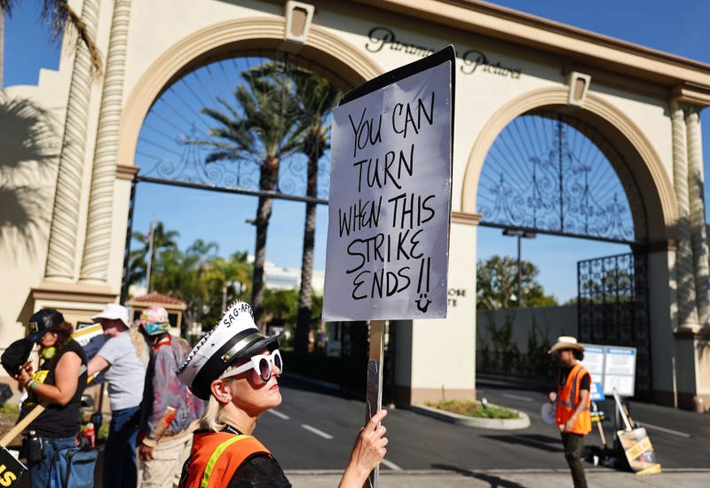 Strike captain SAG-AFTRA member Cari Ciotti holds a sign as SAG-AFTRA members and supporters picket outside Paramount Studios on day 113 of their strike against the Hollywood studios on November 3, 2023 in Los Angeles, California.