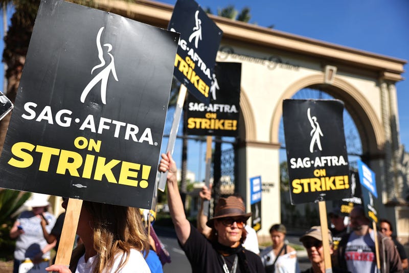 SAG-AFTRA member Caryn West (C) and other members and supporters picket outside Paramount Studios on day 113 of their strike against the Hollywood studios on November 3, 2023 in Los Angeles, California. 