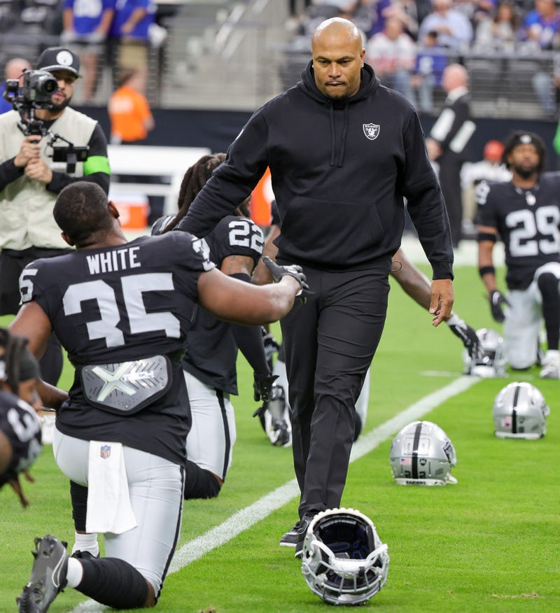 Interim head coach Antonio Pierce of the Las Vegas Raiders greets running back Zamir White #35 on the field during warmups before a game against the New York Giants at Allegiant Stadium on November 05, 2023 in Las Vegas