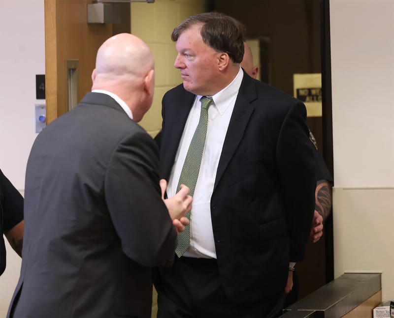 Alleged Gilgo serial killer Rex Heuermann (R) appears before Judge Timothy P. Mazzei with his attorney Michael Brown (2nd R) at Suffolk County Court on January 16, 2024 in Riverhead