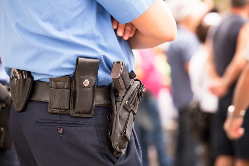  A security guard for Oxford Community Schools accidentally fired his weapon into the ceiling while using the bathroom on Monday, district officials said.