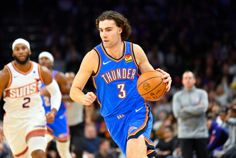Josh Giddey #3 of the Oklahoma City Thunder controls the ball against the Phoenix Suns during the first half at Footprint Center on November 12, 2023 in Phoenix, Arizona.