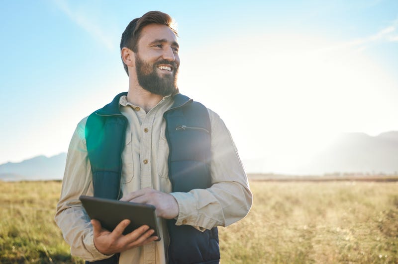 Research or agriculture man on tablet on farm