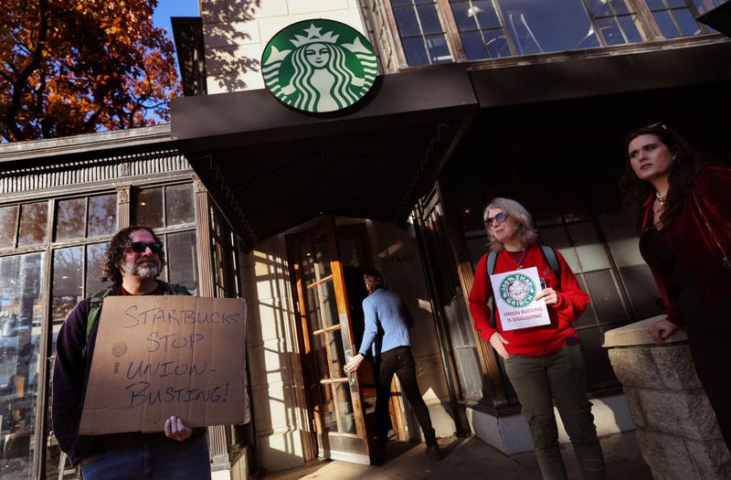 Members and supporters of Starbucks Workers United protest outside of a Starbucks store in Dupont Circle on November 16, 2023 in Washington, DC. The group held a series of rallies on Starbuck's promotional "Red Cup Day" outside of non-union Starbucks stores to demand Starbucks respect union rights. (Photo by Kevin Dietsch/Getty Images)