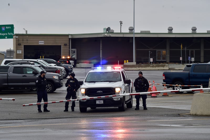 Police stand guard as the Peace Bridge, one of four major crossings into the U.S. from Canada, is closed after a car crashed and exploded at The Rainbow Bridge on November 22, 2023 in Niagara Falls, New York.