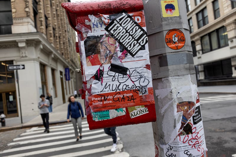 A poster for hostages kidnapped on Oct. 7, 2023, by Hamas in Israel is torn and covered with an anti-Israel sticker, Nov. 7, 2023, in New York City.