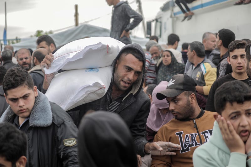 UNRWA distributes flour to Palestinian refugees on Nov. 22, 2023 in Khan Yunis, Gaza.