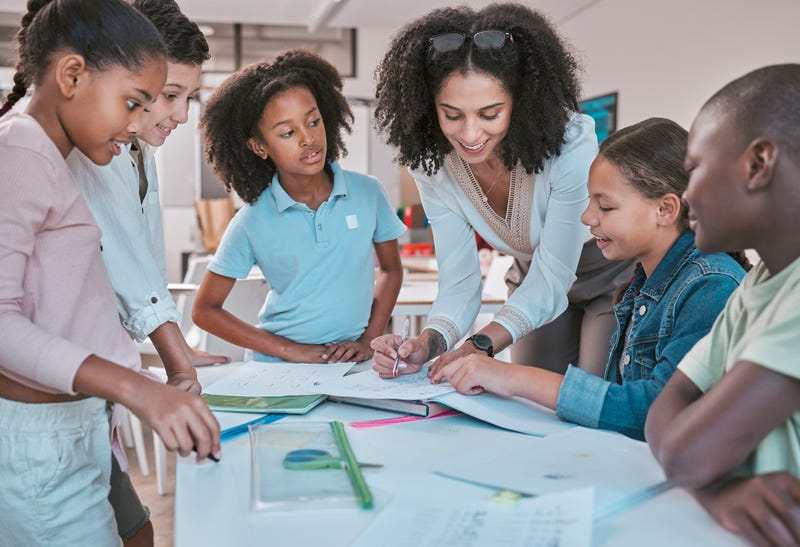 Young teacher with students