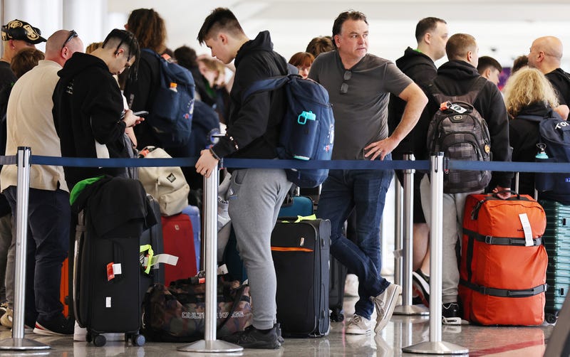people waiting in airport security line