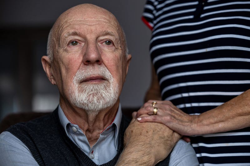 Man with caregiver