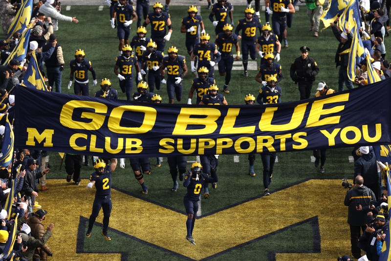 Michigan football team runs onto the field