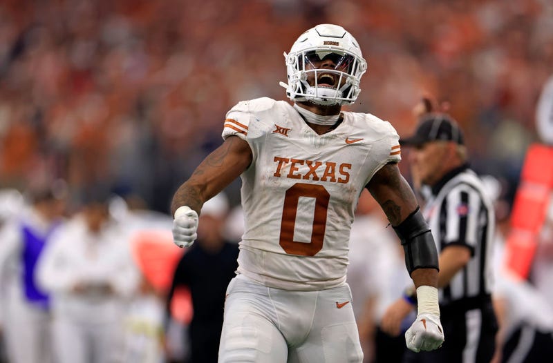 Tight end Ja'Tavion Sanders #0 of the Texas Longhorns celebrates after a first down against the Oklahoma State Cowboys in the first half of the Big 12 Championship at AT&T Stadium on December 2, 2023 in Arlington, Texas.