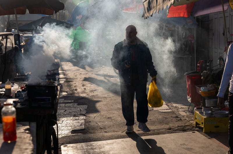 People walk through East Jerusalem during increased tensions between Palestinians and Israelis on December 01, 2023 in Jerusalem. Gunmen, claimed by Hamas to be members of their group, shot numerous Israels at a bus stop on Thursday morning on the outskirts of Jerusalem before being shot dead. Israel and Hamas have resumed fighting following a truce that lasted nearly a week. Both sides had agreed on the release of Israeli hostages held in Gaza, as well as the release of Palestinian prisoners held in Israeli jails. (Photo by Spencer Platt/Getty Images)