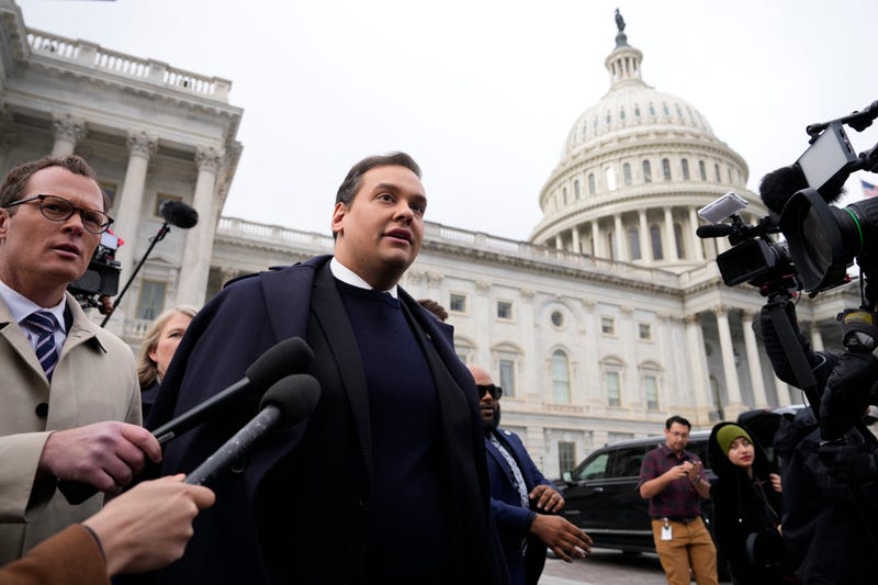 George Santos is surrounded by journalists as he leaves the U.S. Capitol after his fellow members of Congress voted to expel him from the House of Representatives on Dec. 1, 2023