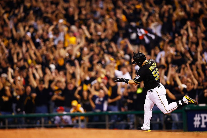Russell Martin #55 of the Pittsburgh Pirates rounds the bases after hitting his solo home run