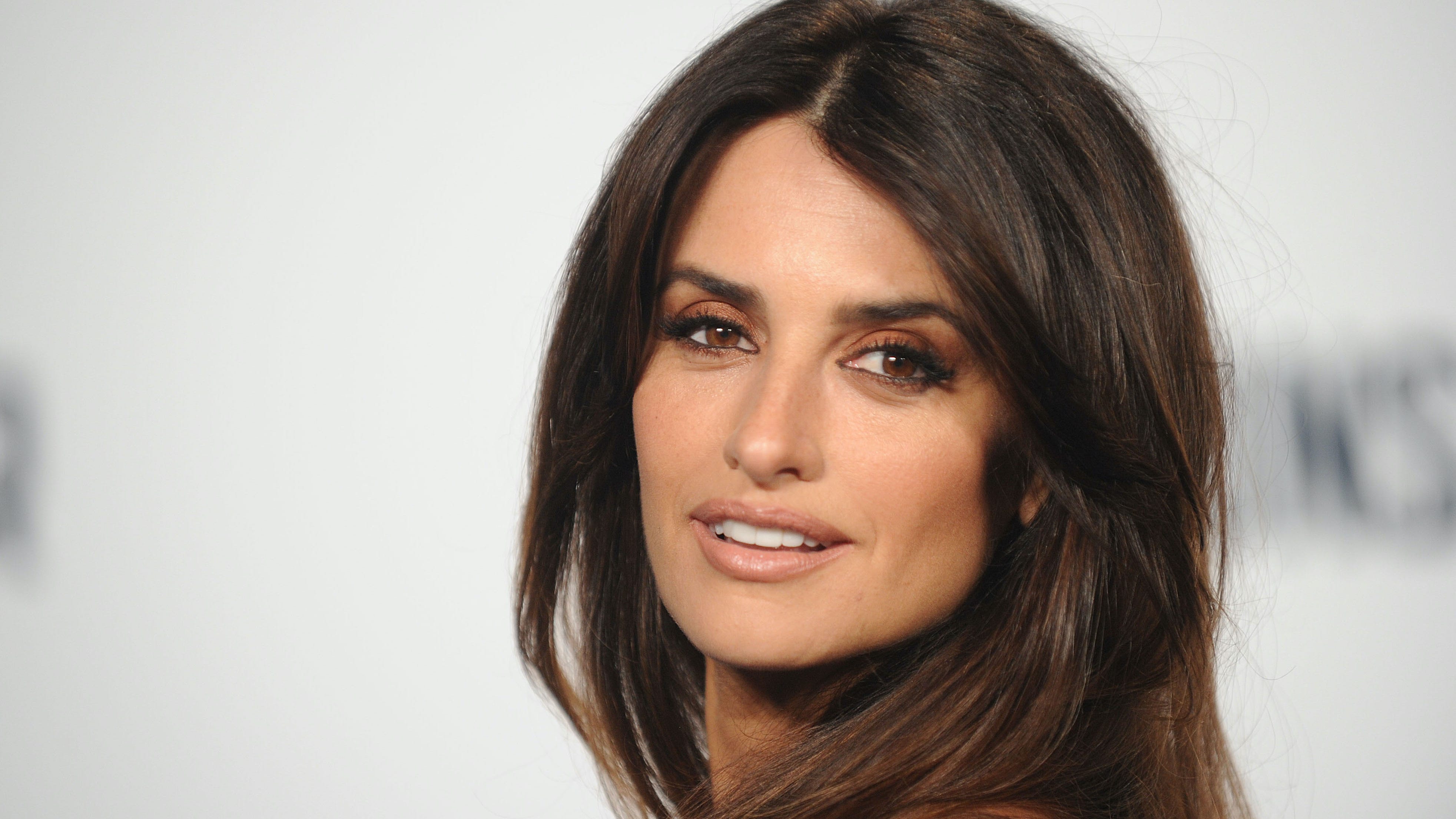 Penelope Cruz, 47, sizzles on the beach in plunging swimsuit with husband Javier Bardem
