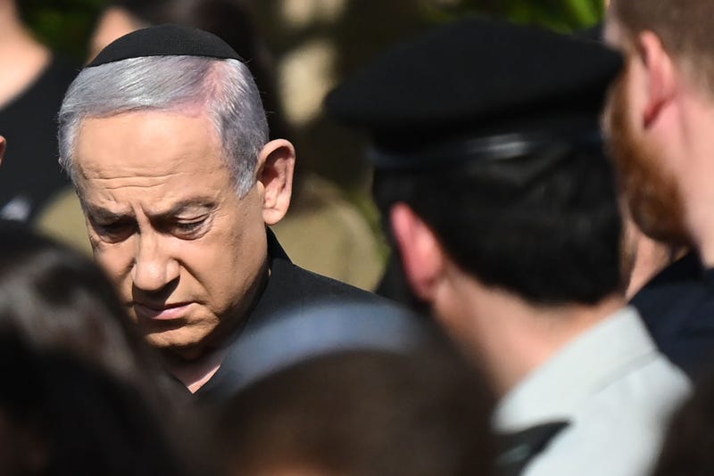Israeli Prime Minister Benjamin Netanyahu (L) attends the funeral for First Sergeant Major Gal Meir Eisenkot, 25 years old, at the Herzliya cemetery on December 8, 2023 in Herzliya, Israel. 