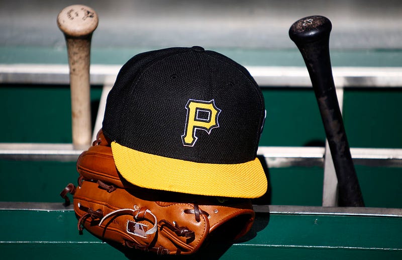 A detailed view of a Pirates hat and glove