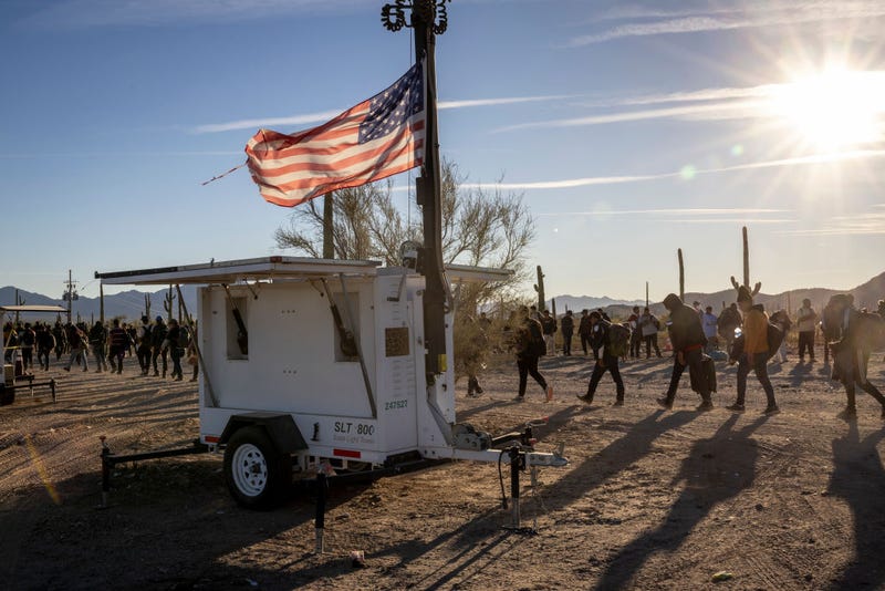 Immigrants arrive to a remote U.S. Border Patrol processing center after crossing the U.S.-Mexico border on December 07, 2023 in Lukeville, Arizona.