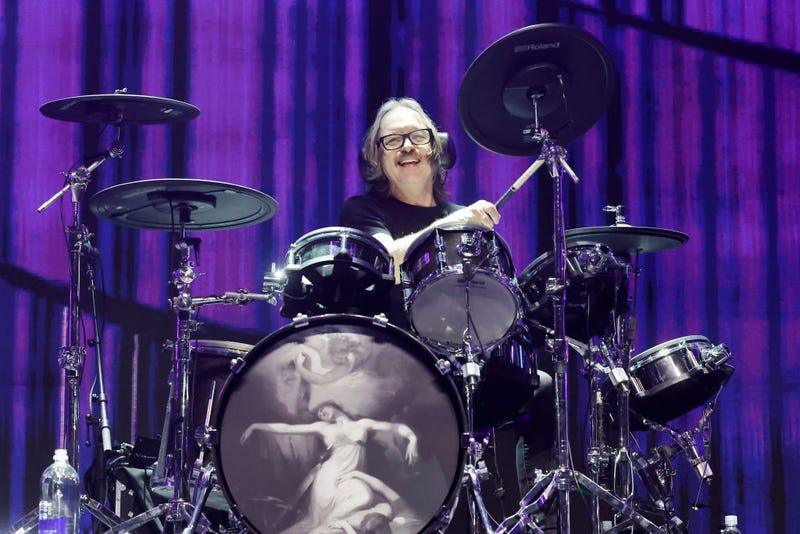 Butch Vig of Garbage smiling behind drum kit