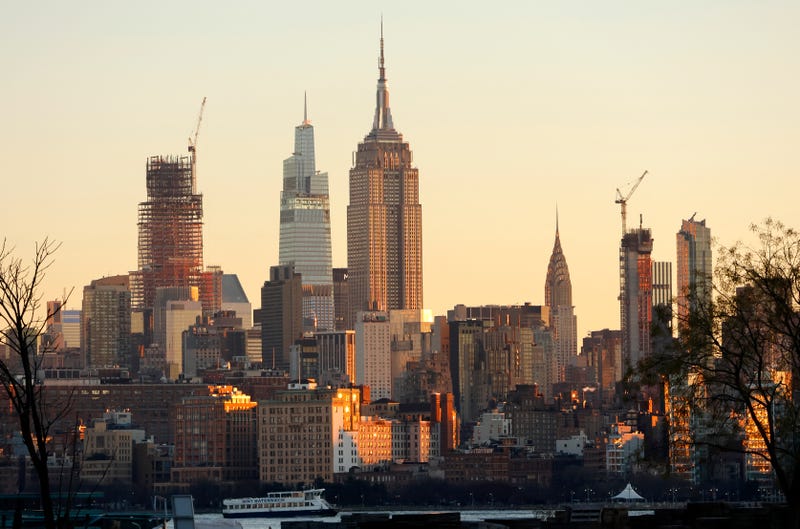 The sun rises over the skyline of Midtown Manhattan on Dec. 12, 2023