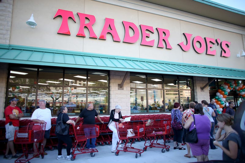 Shoppers lineup as they wait for the grand opening of a Trader Joe's in Pinecrest, Fla. 