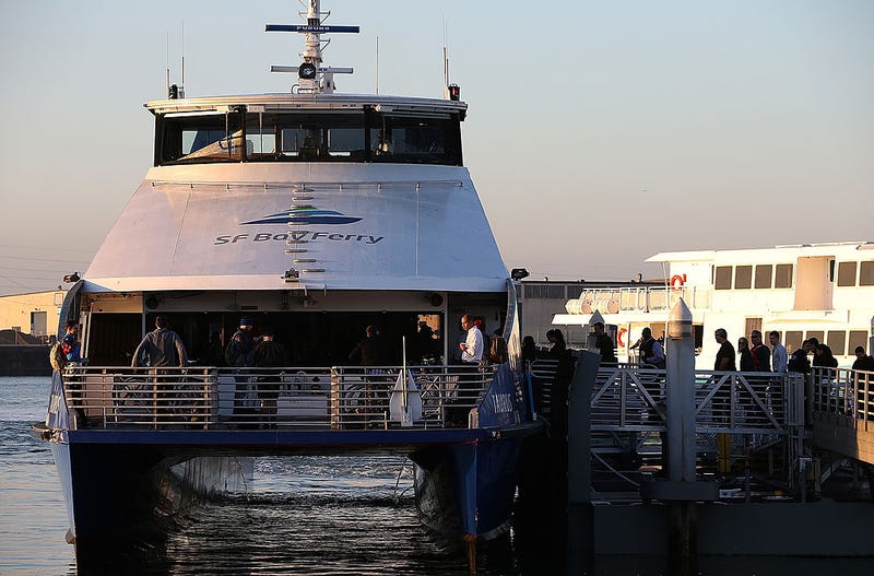 Commuters board the San Francisco Bay Ferry on the first day of the Bay Area Rapid Transit (BART) strike on October 18, 2013 in Oakland, California.