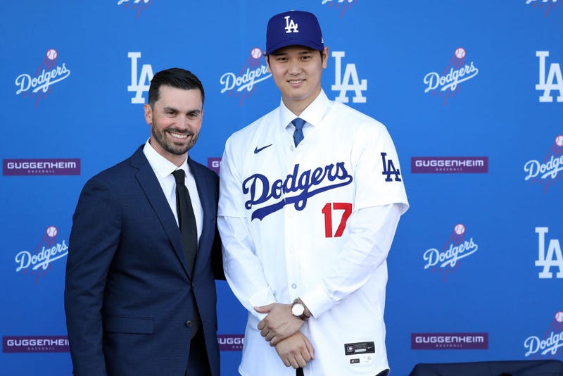 Shohei Ohtani poses for a photo with General Manager Brandon Gomes at Dodger Stadium on December 14, 2023 in Los Angeles, California.