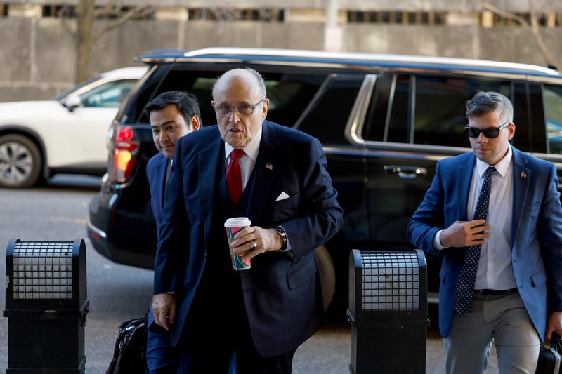 Rudy Giuliani (C), the former personal lawyer for Donald Trump, arrives to the E. Barrett Prettyman U.S. District Courthouse on Dec. 15, 2023