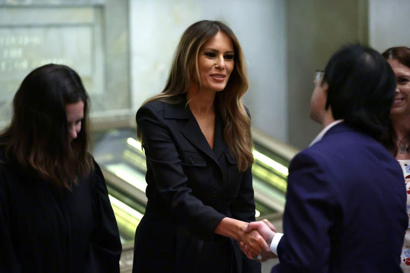 Former U.S. first lady Melania Trump (C) shakes hands with new U.S. citizens during a naturalization ceremony at the National Archives on December 15, 2023 in Washington, DC. During the ceremony 25 people from 25 nations were sworn in as new U.S. citizens. (Photo by Alex Wong/Getty Images)