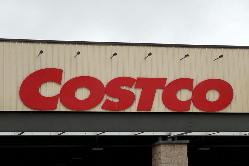 A Costco sign hangs over the entrance to a wholesale store on December 15, 2023 in Miami, Florida.