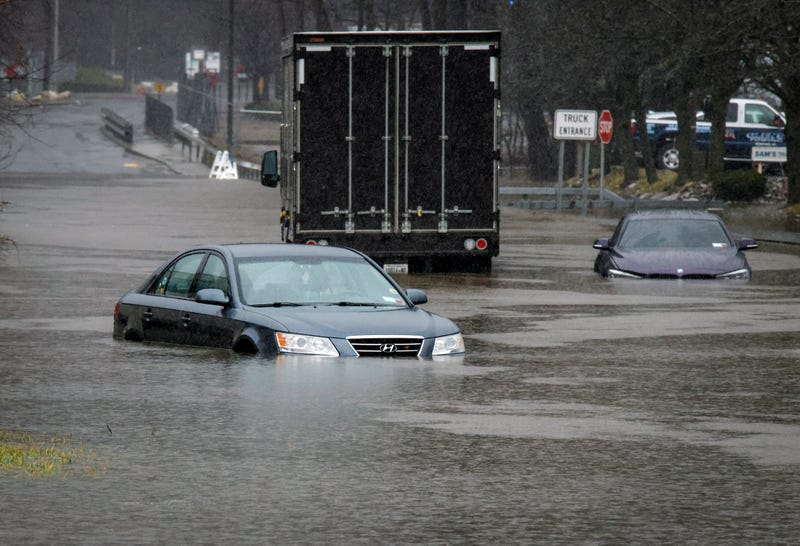 Cars are seen abandoned in floodwater in Elmsford on Dec. 18, 2023