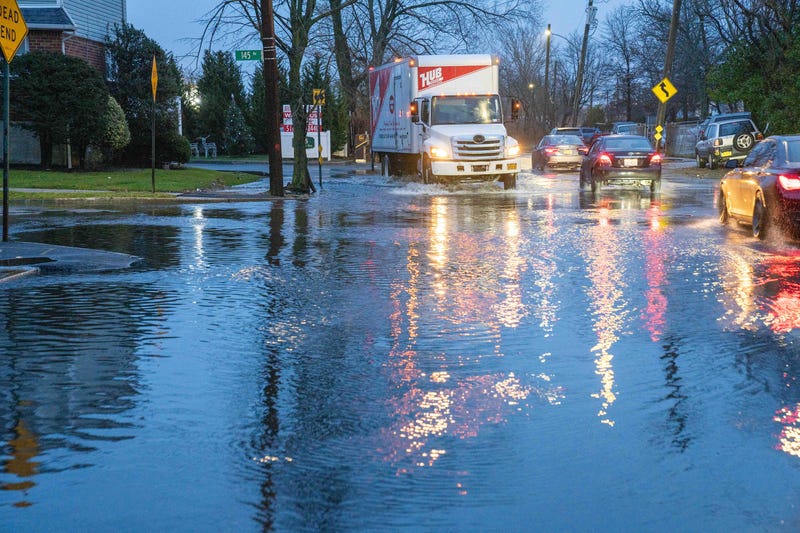 Floodwaters block the intersection of Hook Creek Boulevard at 145th Avenue in Rosedale, Queens, on Dec. 18, 2023
