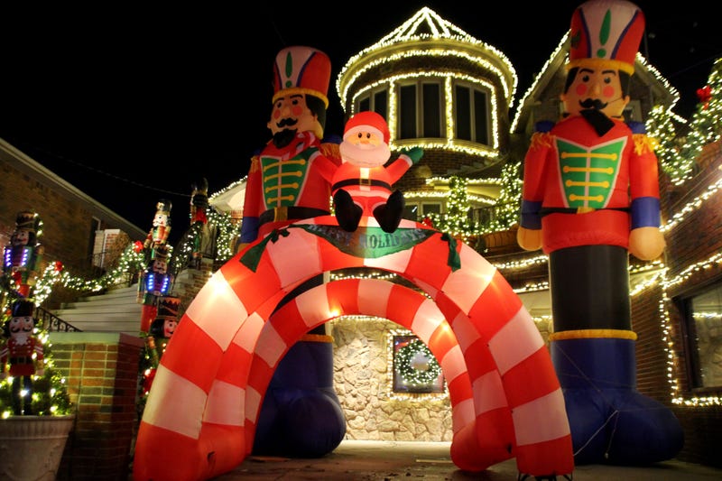 An inflatable Santa Clause and nutcrackers in front of a home on Dec. 18, 2023