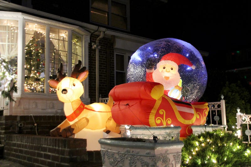 An inflatable Santa and Rudolf outside a home on Dec. 18, 2023