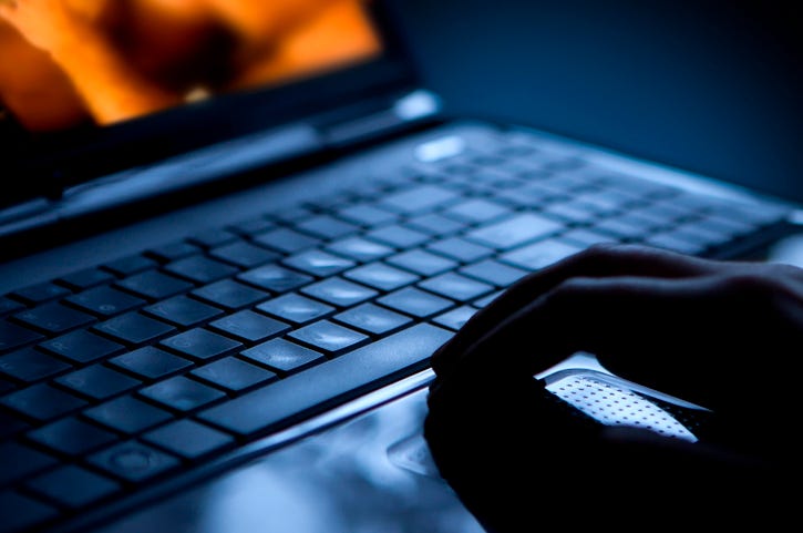 watching porn on a laptop
