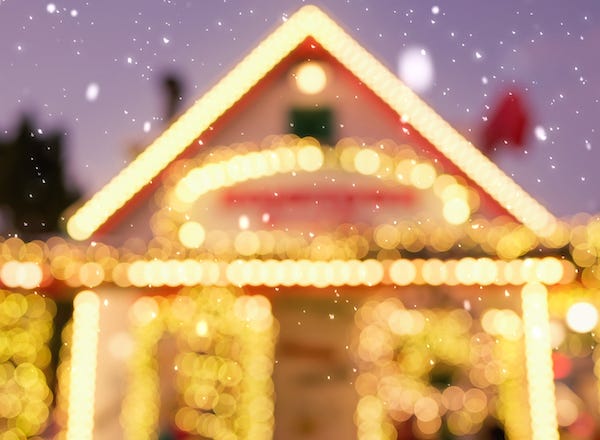 Blurry image of a house decorated with Christmas lights