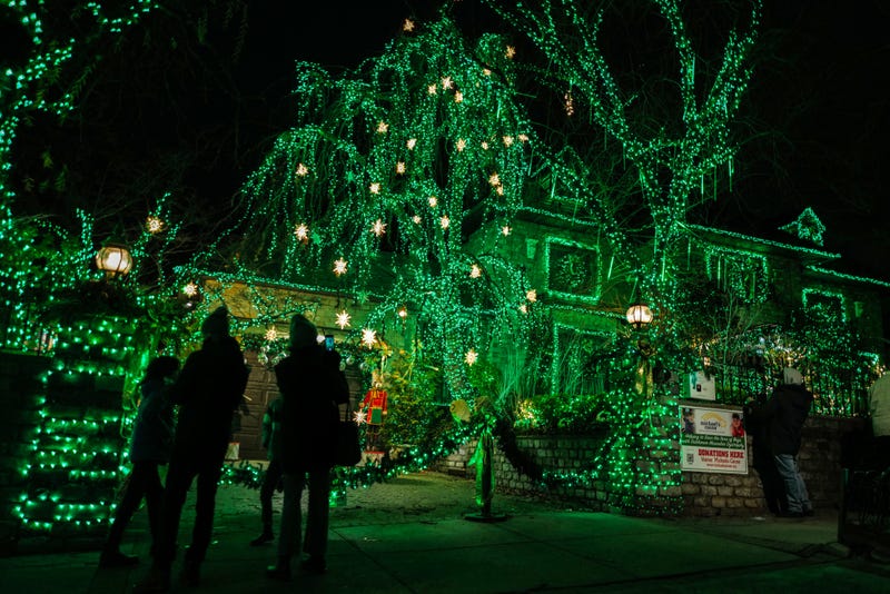 Green lights beam from a home in Dyker Heights on Dec. 20, 2023
