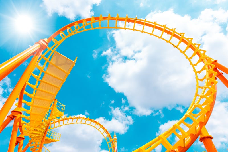 Rollercoaster railroad track high to the sky roll bend and twist for exciting fun at theme park