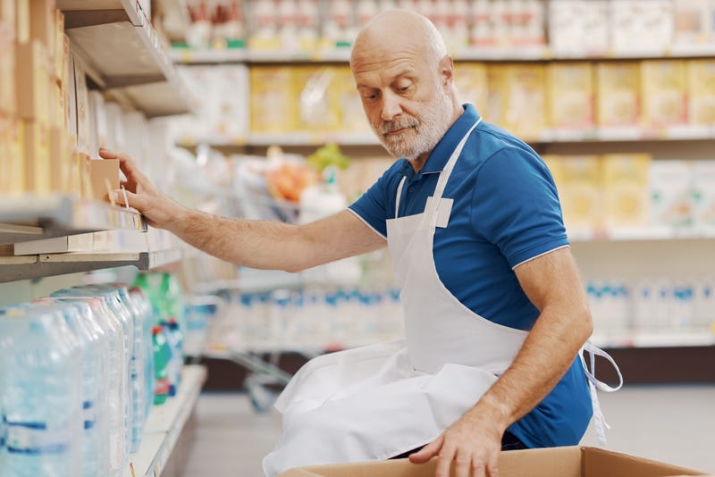 Stock clerk working at the supermarket.