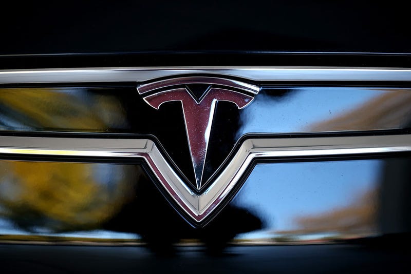 Tesla logo on front of car