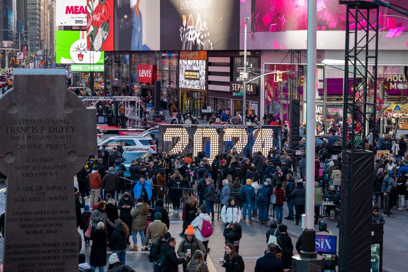 People walk by an installation with the 2024 numerals at Times Square on Dec. 20, 2023