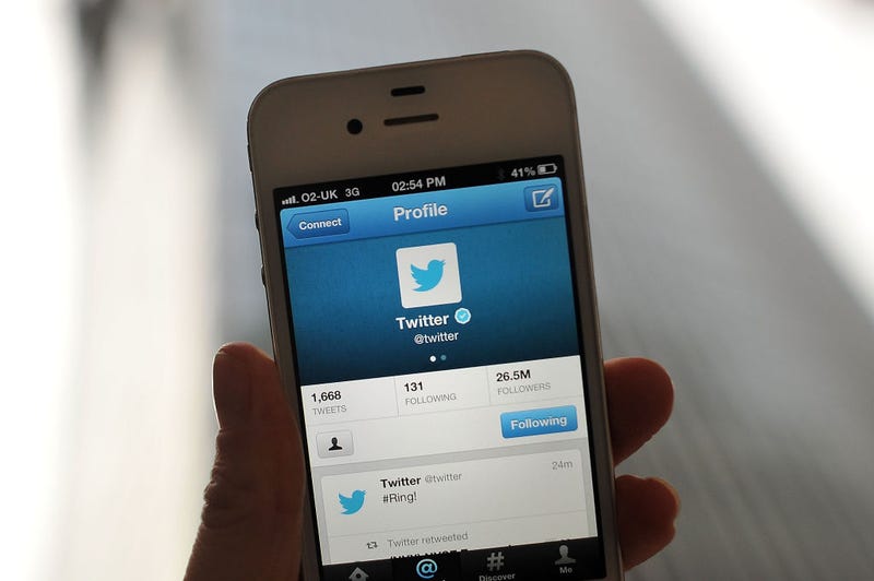  In this photo illustration, the Twitter logo and hashtag '#Ring!' is displayed on a mobile device as the company announced its initial public offering and debut on the New York Stock Exchange on November 7, 2013 in London, England.